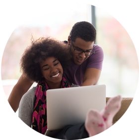 smiling couple with laptop